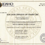 Logo of USA Cash Services, located in Idaho, Inc., representing financial services and cash management solutions.