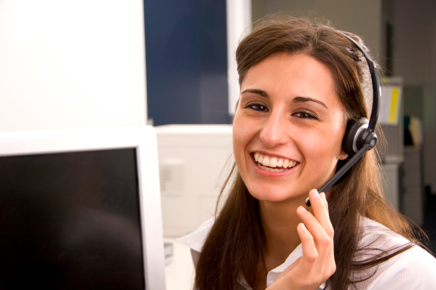 A woman wearing a headset, ready to assist and communicate. USA Cash Services Management Incorporated