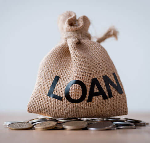 Conceptual image of a loan represented by coins in a jute bag