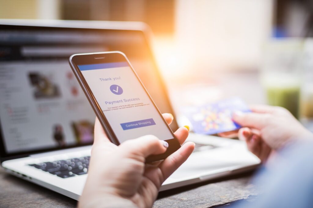 A person checking a credit card website on a smartphone