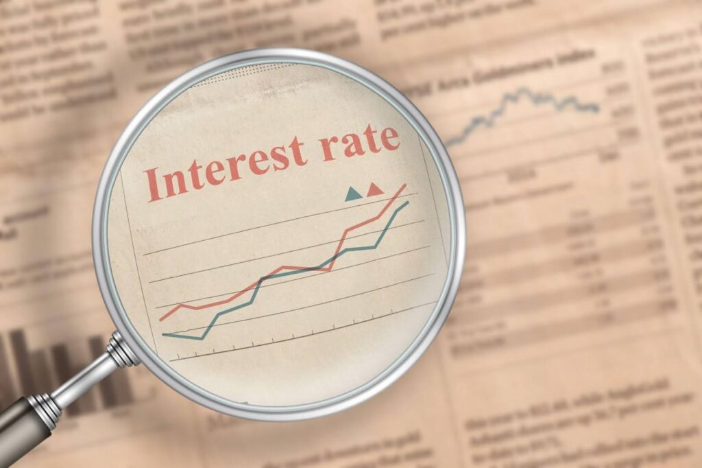 A newspaper displaying interest rates for personal installment loans and other financial products.