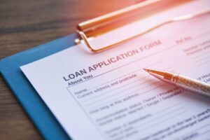 Clipboard holding a loan application form awaiting user input