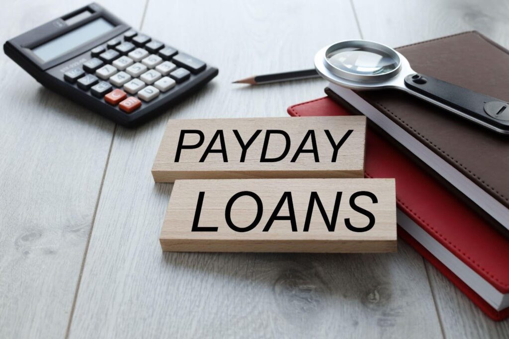 Payday loan ad next to a financial calculator illustrating loan options